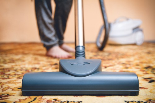 Vacuuming Persian rug