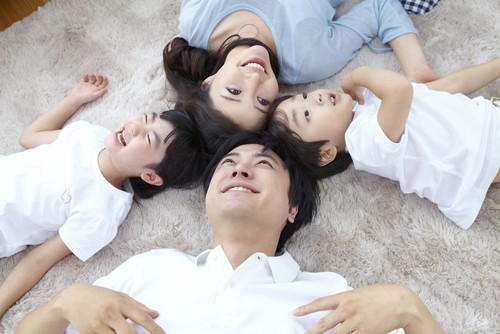 Happy healthy family on clean carpet